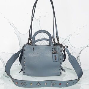 Coach Rogue Light Blue Pebbled Leather Satchel with crossbody strap